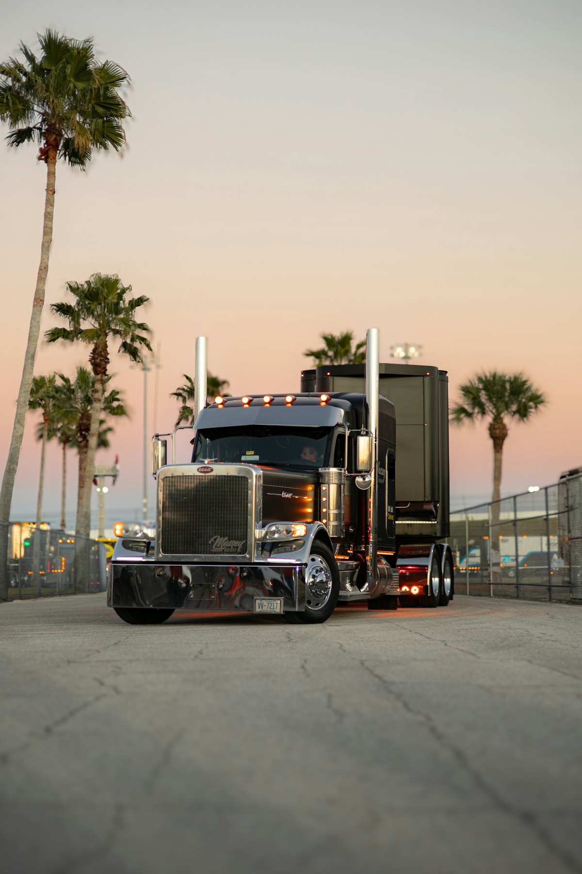American Peterbilt semi truck at sunset.
