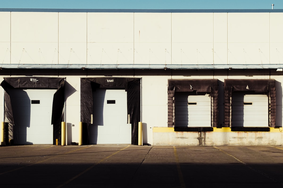 US warehouse loading dock with multiple bay doors.